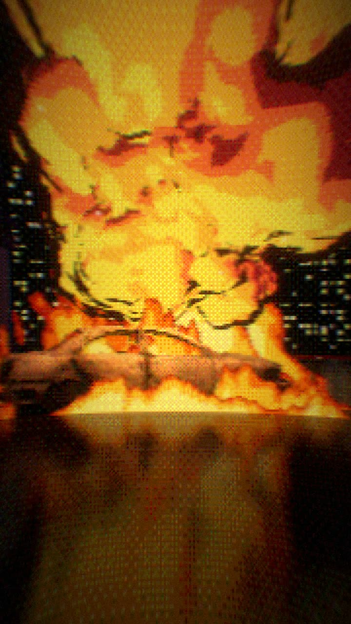 A car burning in a city street at night
